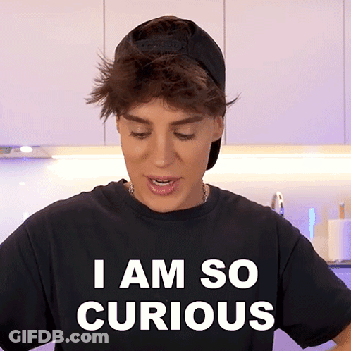 A Person Wearing A Black Shirt That Says " I Am So Curious " GIF
