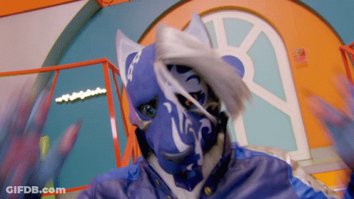 A Person Wearing A Blue And White Mask With The Letter R On It GIF
