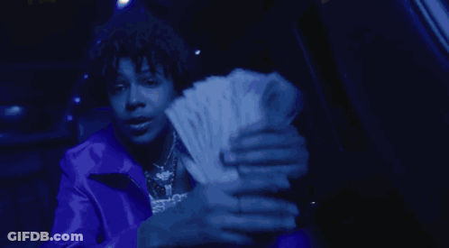 A Person Wearing A Blue Jacket And A Necklace That Says Spkp GIF
