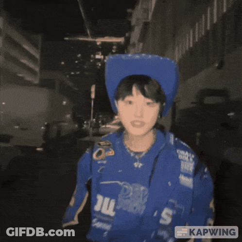 A Person Wearing A Blue Jacket That Says Ni Howdy On It GIF