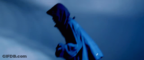 A Person Wearing A Blue Jacket With A Hood On GIF