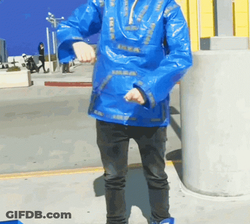 A Person Wearing A Blue Jacket With Ikea On It GIF