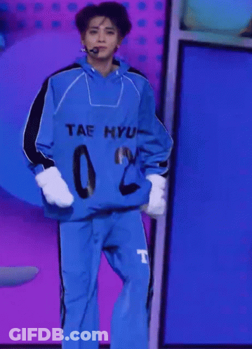 A Person Wearing A Blue Shirt That Says Tae Hyun GIF