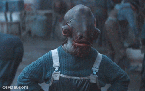 A Person Wearing A Blue Sweater And Overalls Has A Very Large Mouth GIF