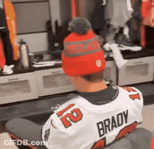 A Person Wearing A Brady Jersey And A Red Hat GIF