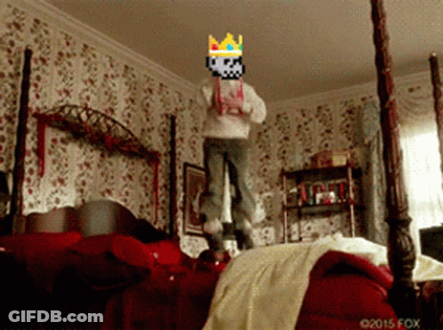 A Person Wearing A Crown Is Jumping On A Bed In A Bedroom GIF