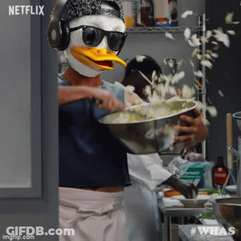 A Person Wearing A Duck Mask Is Preparing Food In A Kitchen With A Netflix Logo In The Background GIF