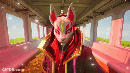 A Person Wearing A Fox Mask In A Pink Room GIF