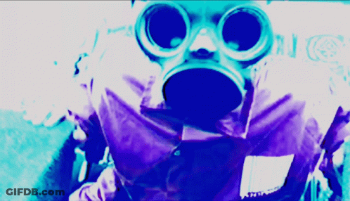 A Person Wearing A Gas Mask And Goggles With A Purple Background GIF