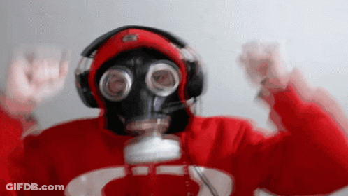 A Person Wearing A Gas Mask And Headphones Is Wearing A Red Sweatshirt With A C On It GIF