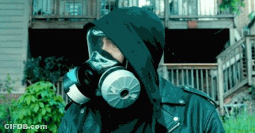 A Person Wearing A Gas Mask With A Hood On GIF