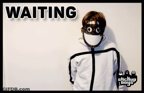 A Person Wearing A Gas Mask With The Word Waiting Behind Them GIF