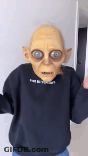 A Person Wearing A Gollum Mask And A Sweater That Says For Better Days . GIF