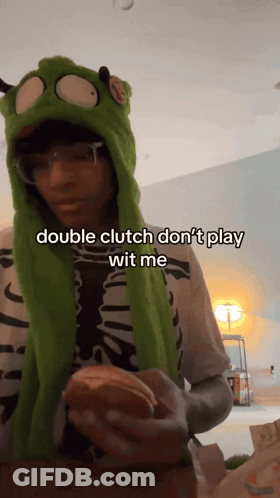 A Person Wearing A Green Hat Says Double Clutch Don T Play Wit Me GIF