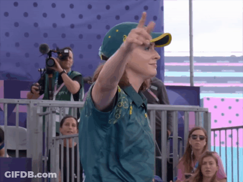 A Person Wearing A Green Shirt With The Word Australian On It GIF