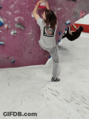 A Person Wearing A Grey Shirt That Says Enjoy The Moment On The Back GIF