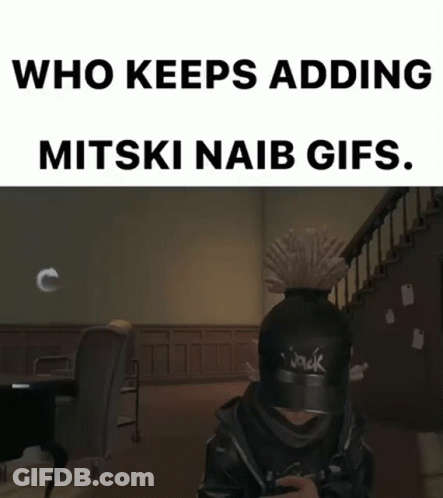 A Person Wearing A Hat With The Word Jack On It Is Sitting In A Room . GIF