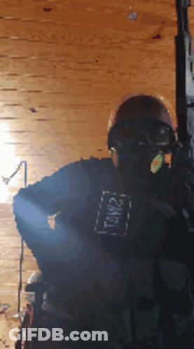 A Person Wearing A Helmet And A Shirt That Says Tnw21 GIF