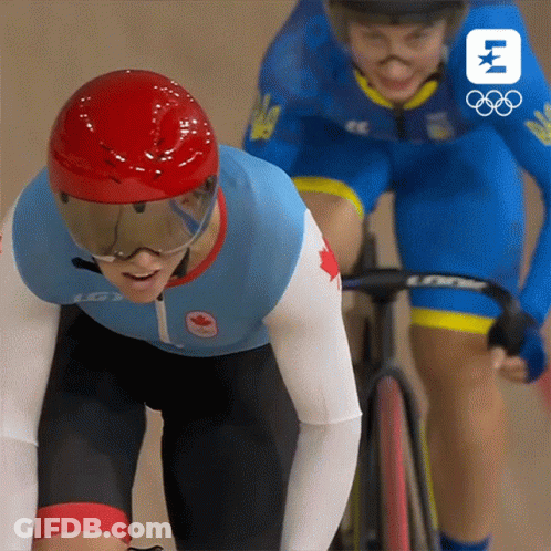 A Person Wearing A Helmet And Goggles Is Riding A Bike Next To Another Person GIF