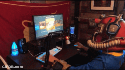 A Person Wearing A Helmet And Headphones Is Playing A Video Game GIF
