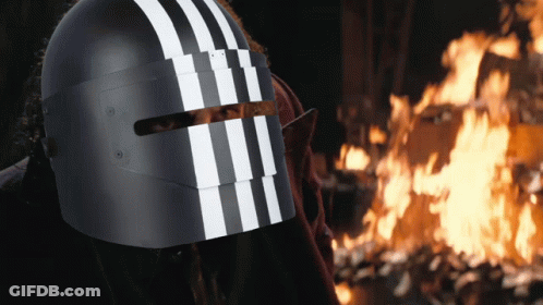 A Person Wearing A Helmet With White Stripes On It GIF