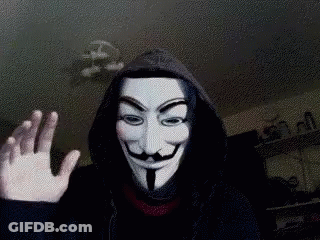 A Person Wearing A Hooded Jacket And A Anonymous Mask Is Waving GIF