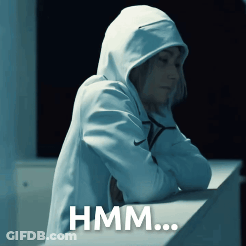 A Person Wearing A Hooded Sweatshirt With The Word Hmm Written On It GIF
