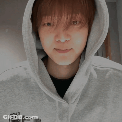 A Person Wearing A Hoodie Giving A Thumbs Up Sign GIF