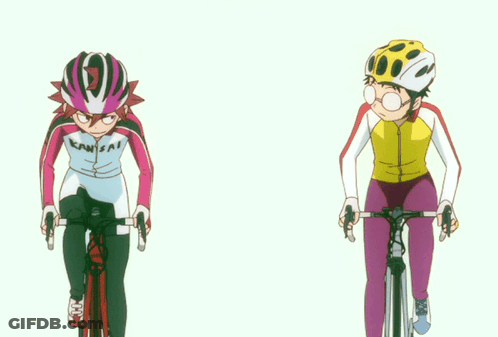 A Person Wearing A Kawasaki Shirt Is Riding A Bike Next To Another Person GIF