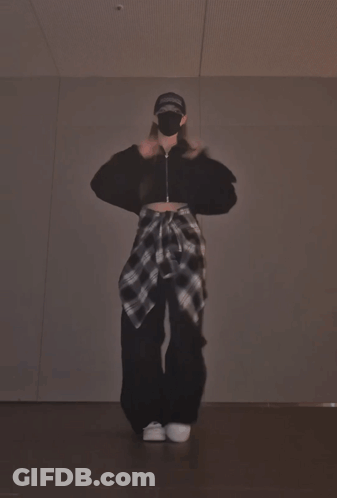 A Person Wearing A Mask And A Hat That Says Supreme Is Dancing GIF