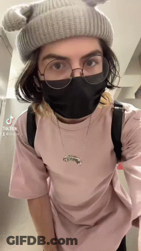 A Person Wearing A Mask And Glasses Has Tiktok Written On The Bottom Right Corner GIF