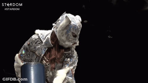 A Person Wearing A Mask And Holding A Sword With The Word Stardom Written On The Bottom GIF