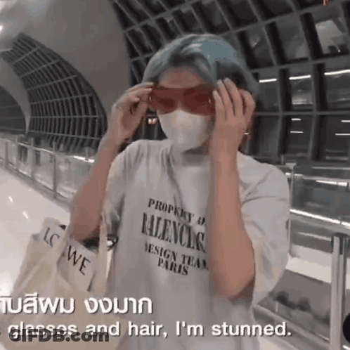 A Person Wearing A Mask And Sunglasses Is Stunned . GIF