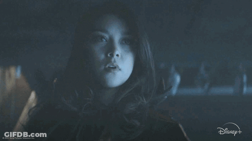 A Person Wearing A Mask With A Disney Logo On The Bottom Right GIF