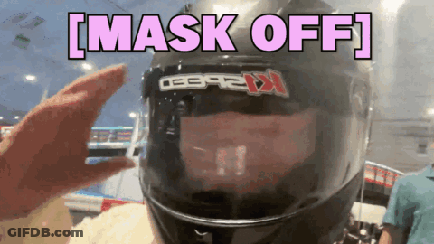 A Person Wearing A Motorcycle Helmet With The Words Mask Off Above It GIF