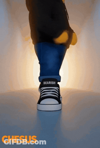 A Person Wearing A Pair Of Black And White Sneakers With The Word Bearish On The Side GIF