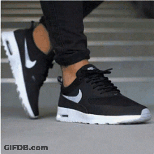 A Person Wearing A Pair Of Black Nike Air Max Thea Sneakers GIF