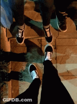 A Person Wearing A Pair Of Black Vans Sneakers GIF