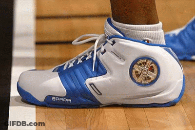 A Person Wearing A Pair Of Blue And White Shoes With The Word Dada On The Side GIF