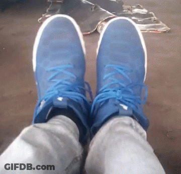 A Person Wearing A Pair Of Blue And White Sneakers GIF
