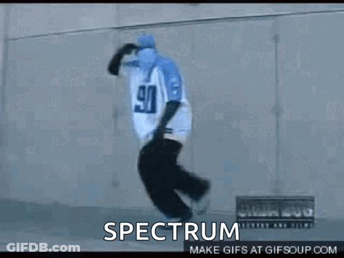 A Person Wearing A Pair Of Blue Slippers With The Word Spectrum On The Bottom GIF