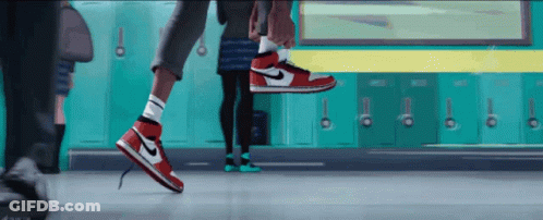 A Person Wearing A Pair Of Red And White Nike Air Jordans GIF