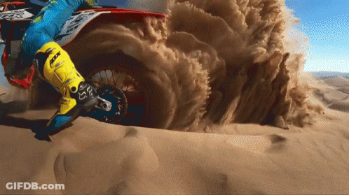 A Person Wearing A Pair Of Yellow Fox Boots Is Riding A Dirt Bike GIF