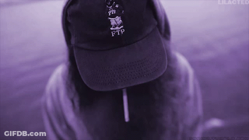 A Person Wearing A Purple Ftp Hat And A Purple Background GIF