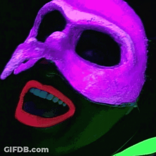 A Person Wearing A Purple Mask With A Skull On It GIF