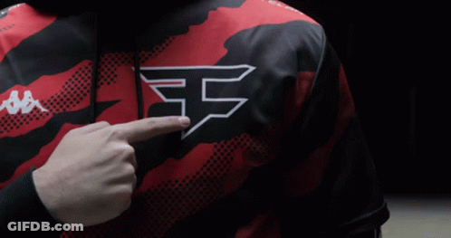 A Person Wearing A Red And Black Shirt With The Letter F On The Chest GIF