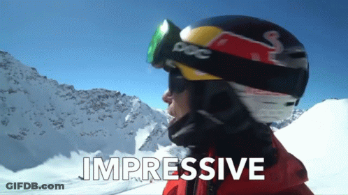 A Person Wearing A Red Bull Helmet And Goggles With The Words Impressive Below Them GIF