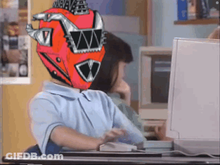 A Person Wearing A Red Helmet With The Letter W On It Is Sitting In Front Of A Computer GIF