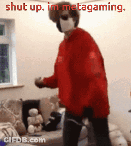 A Person Wearing A Red Sweater And A Mask Is Standing In A Living Room With The Words Shut Up . Im Metagaming . GIF