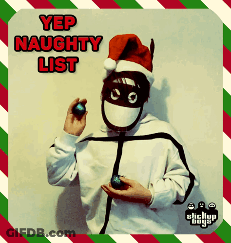 A Person Wearing A Santa Hat And Mask Holding A Christmas Ornament With The Words Yep Naughty List Written Above Them GIF